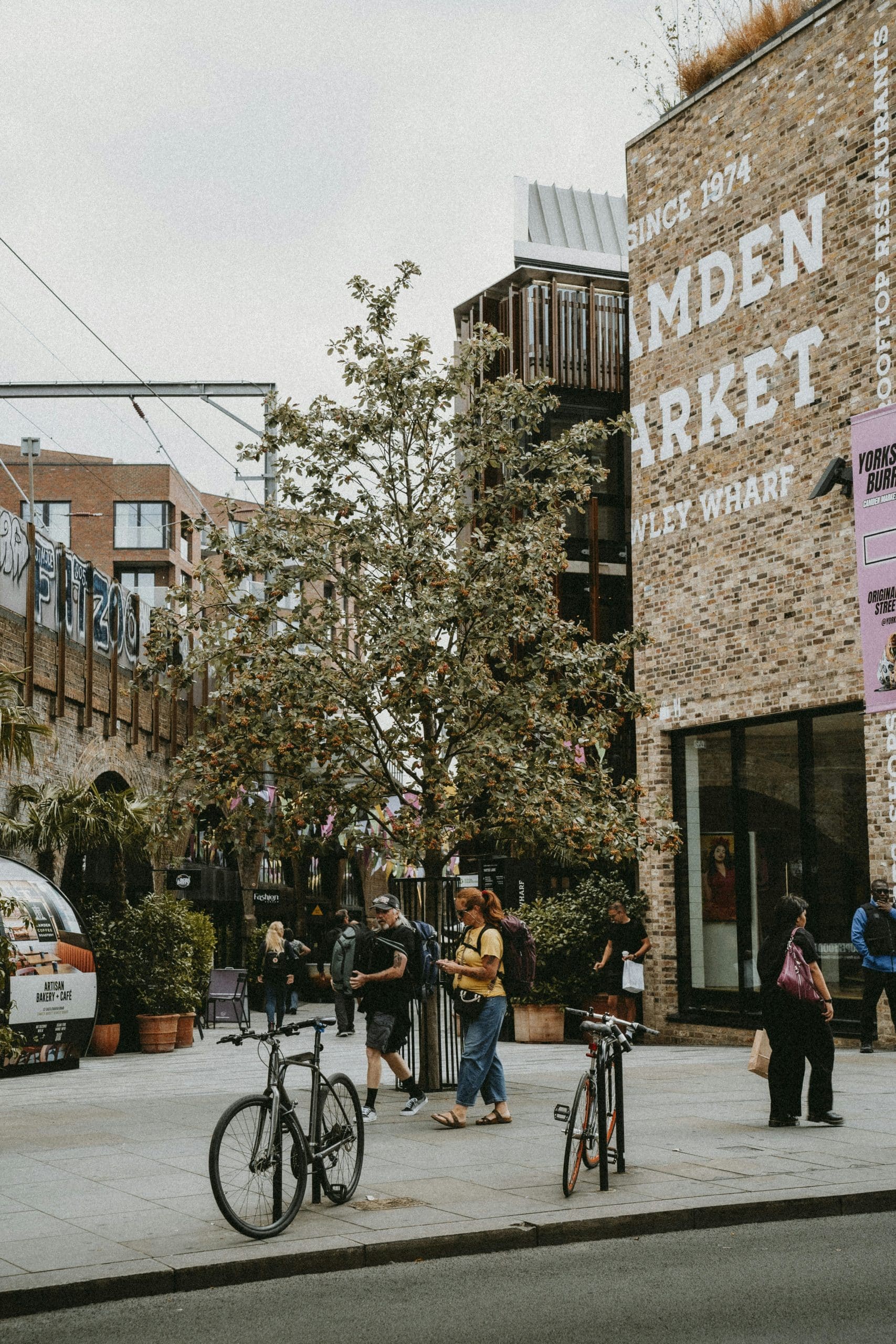 People and bicycles outside of HawleyWharf, Camden markets